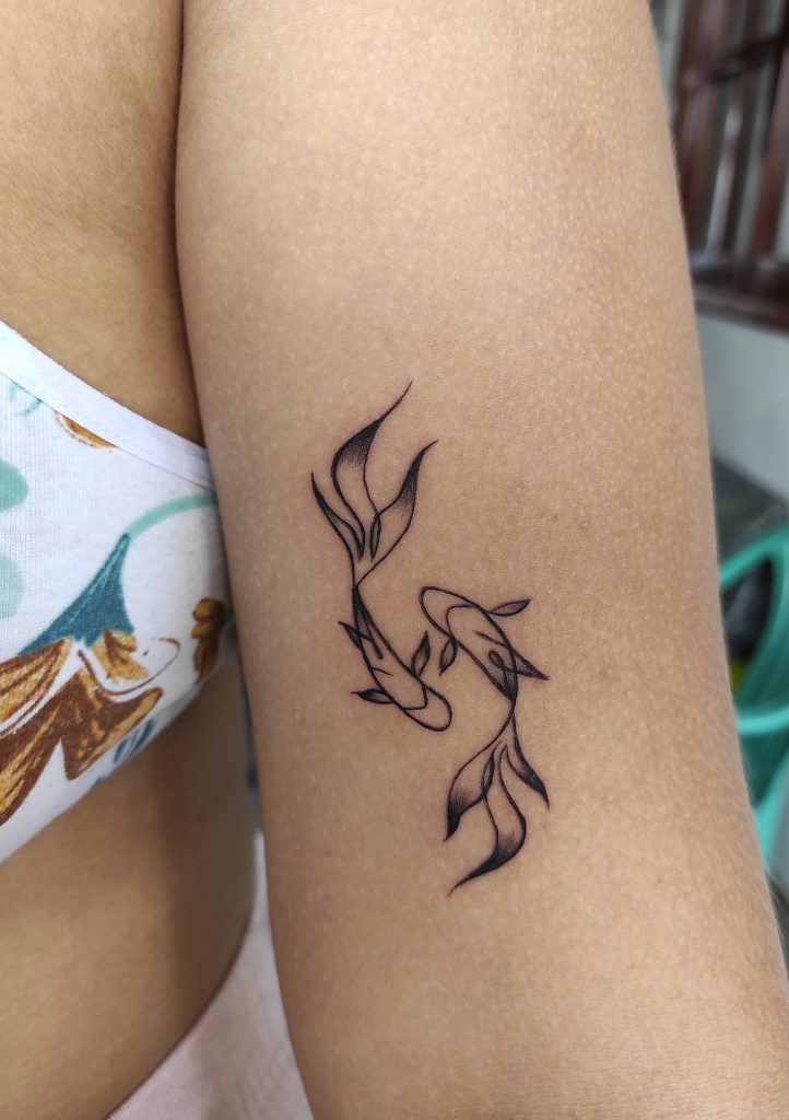Tatuajes de peces en el brazo